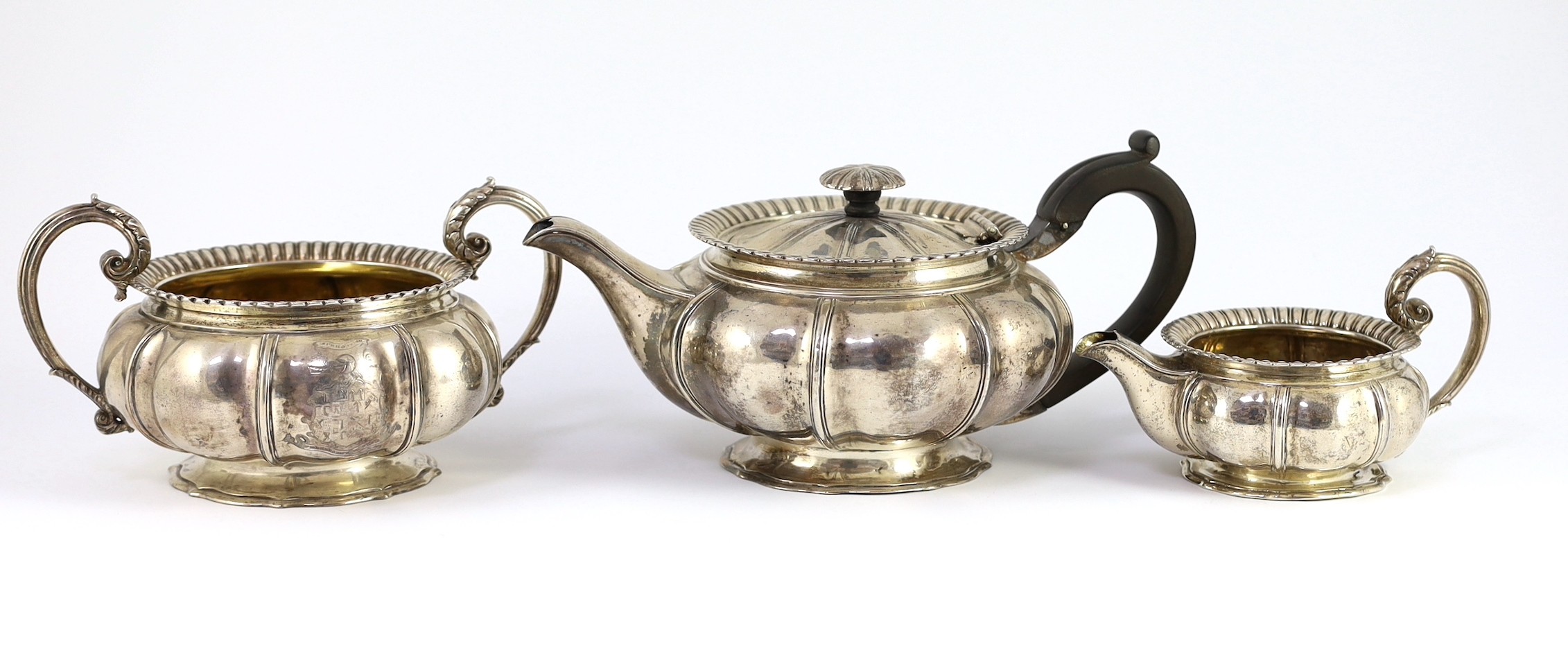 A George IV silver three piece tea set by Benjamin Smith III